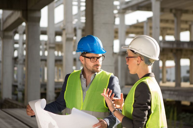 Roofing team discussing project